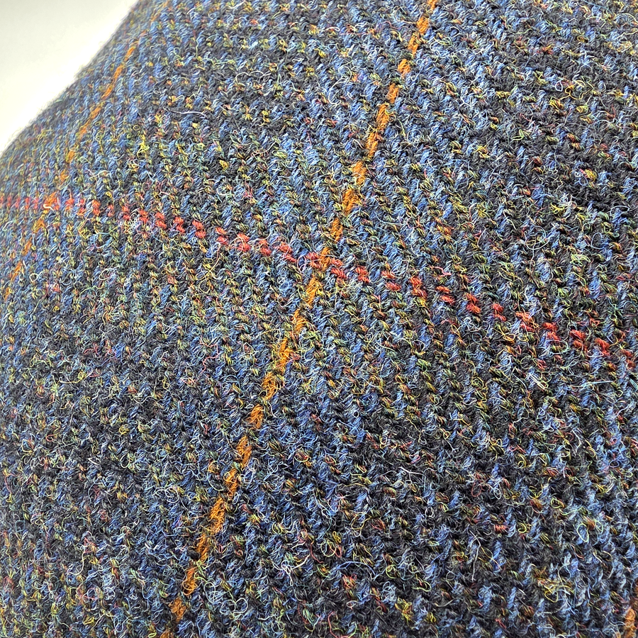 Close-up of the blue Harris Tweed with orange and red overcheck